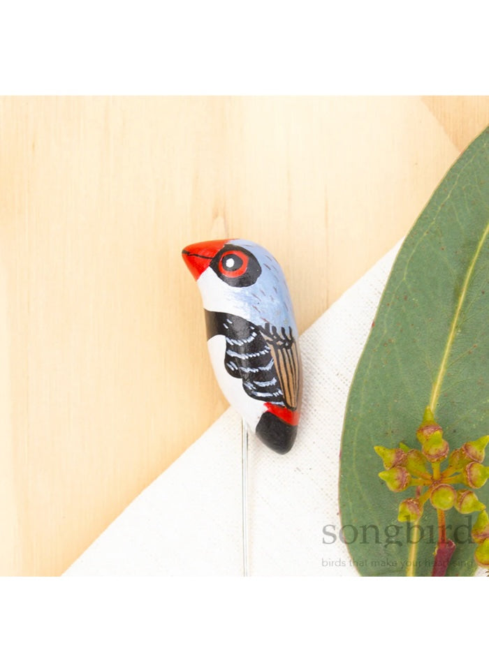 A Diamond Firetail lapel or hat pin by Songbird.