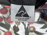 Label indicating 'Australian Made and Owned' on a product with a floral pattern.