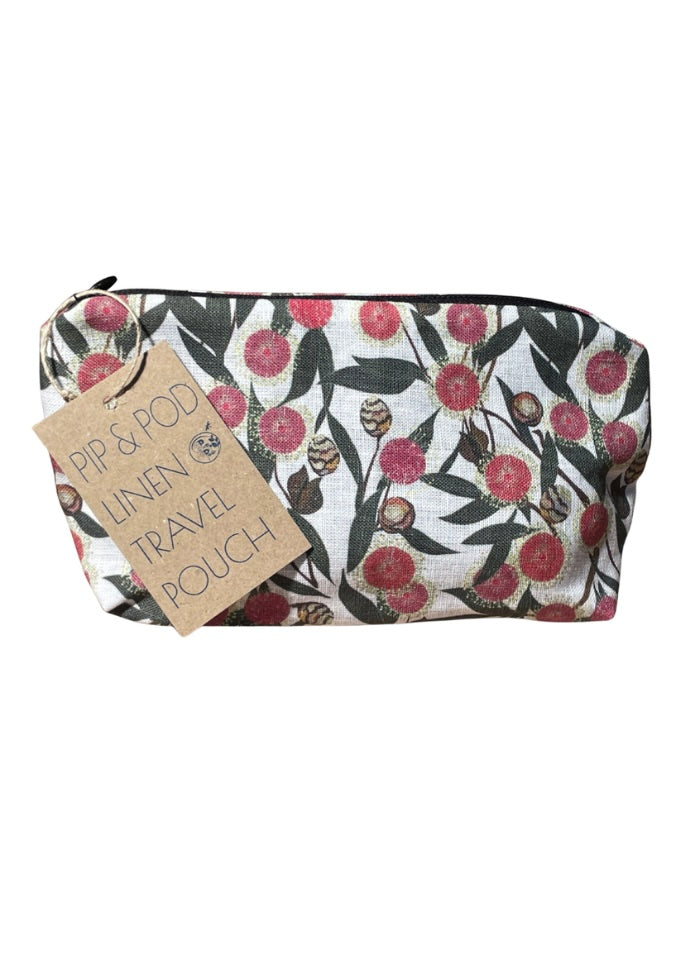 Linen travel pouch with floral pattern and 'Pip & Pod' tag on a white background