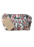 Linen travel pouch with floral pattern and 'Pip & Pod' tag on a white background