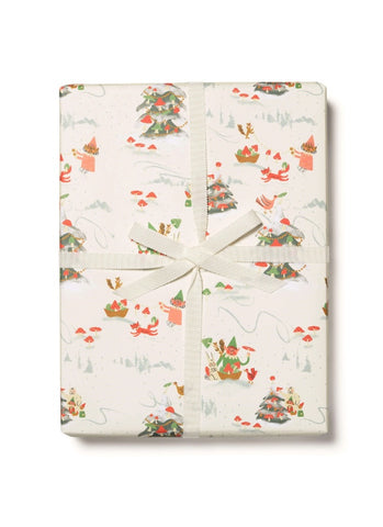 Gift wrap with Christmas-themed design featuring trees, presents, and elves on a white background.