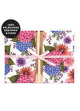 Floral gift wrap with a pink ribbon on a white background, featuring '100% Melbourne Designed & Made' text.