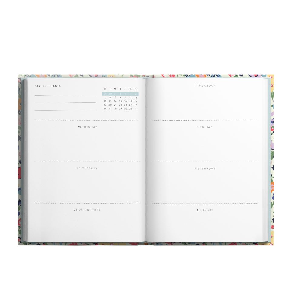 Open planner with calendar and weekly layout on a white background