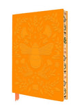 Orange notebook with bee and floral design on a white background