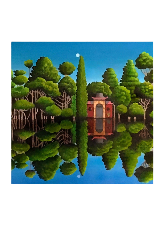 A river reflecting green trees and blue sky and a red building on the riverbank.