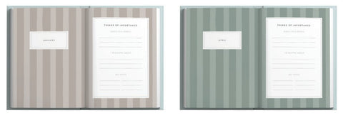Two notebooks with striped covers and white pages displaying text.