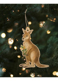 Kangaroo ornament hanging on a Christmas tree with lights in the background