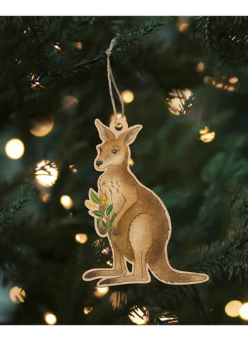 Kangaroo ornament hanging on a Christmas tree with lights in the background