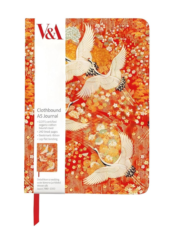Notebook with cranes design on a red background, featuring V&A branding.