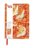 Notebook with cranes design on a red background, featuring V&A branding.