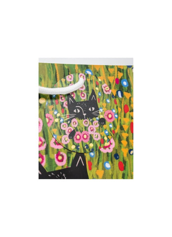 A yellow paper gift bag with a black cat in a field of flowers by Niaski