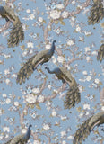 Pattern of peacocks and floral branches on a blue background