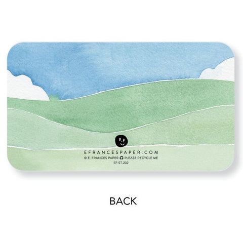 Card with a scenic design of green hills and blue sky, featuring E. Frances Paper branding.