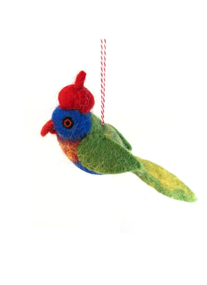 Colorful bird-shaped ornament with a red hat on a white background