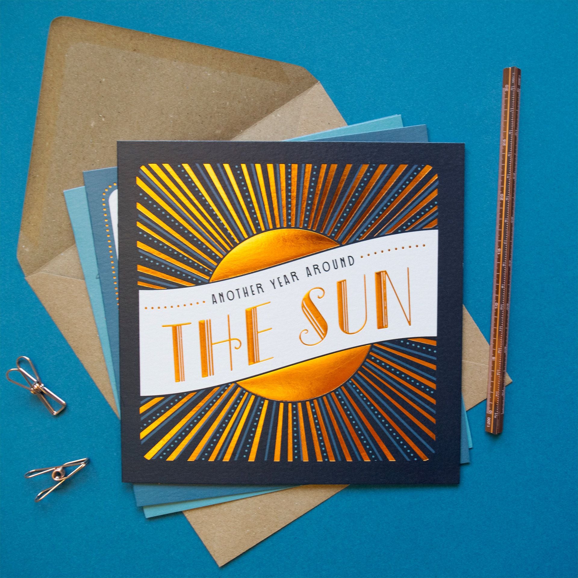 Card with sun design and text on a blue background