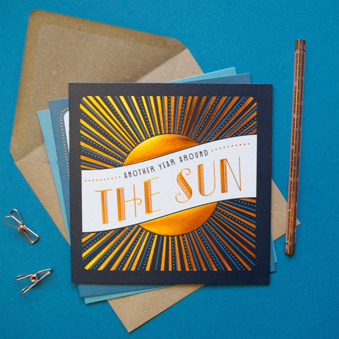 Card with sun design and text on a blue background