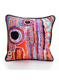 Colorful decorative pillow with abstract pattern on a white background