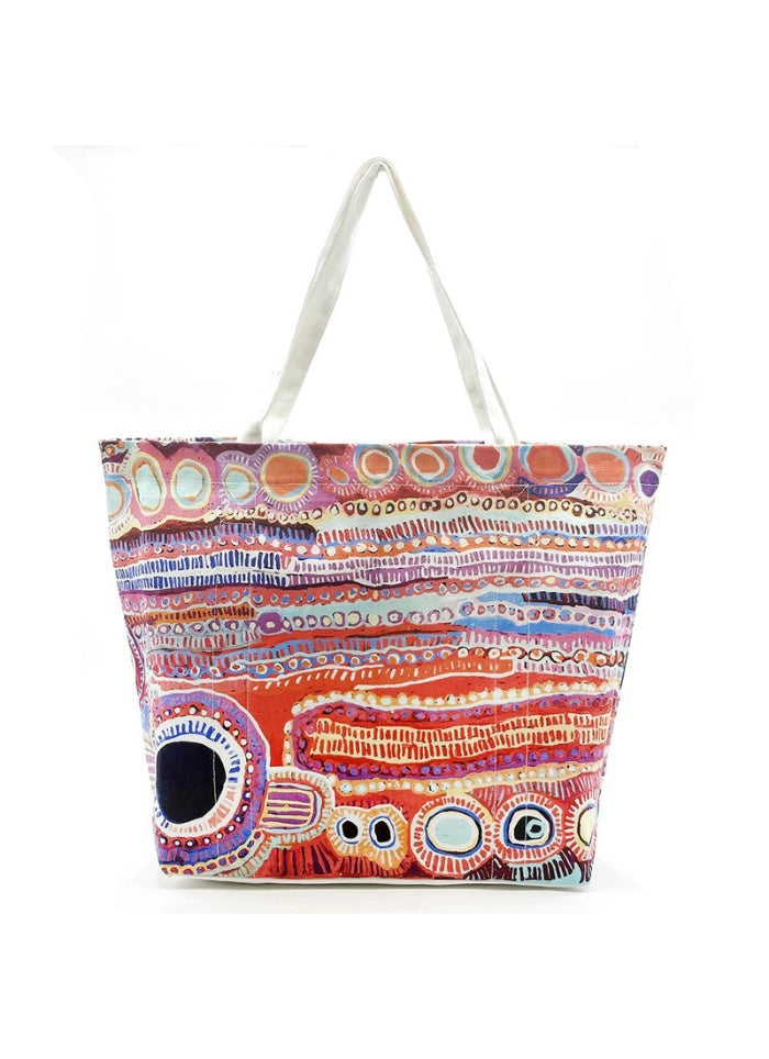 A canvas tote bag produced by Better World Arts and based on artwork by Murdie Nampijinpa Morris.