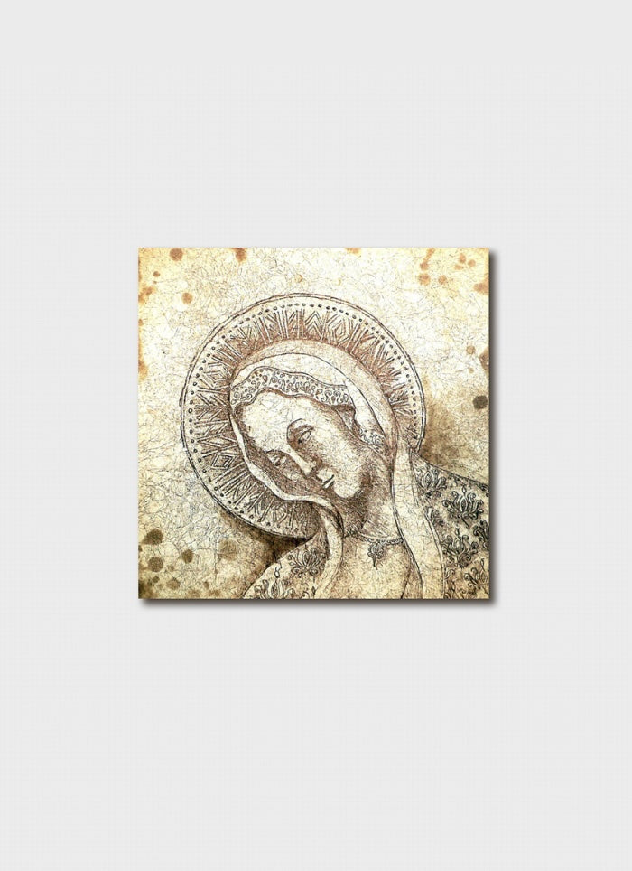 Decorative tile with a religious icon of a woman's face on a textured beige background