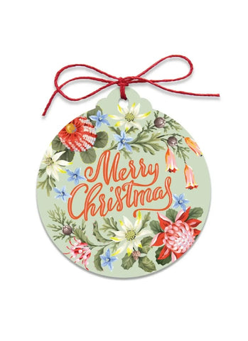 Decorative Christmas ornament with floral design and 'Merry Christmas' text on a white background