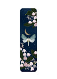 Bookmark with a design of a moth, flowers, and a moon on a dark blue background