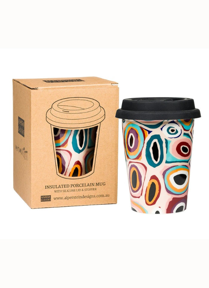 Colorful insulated mug with patterned design next to its packaging on a white background