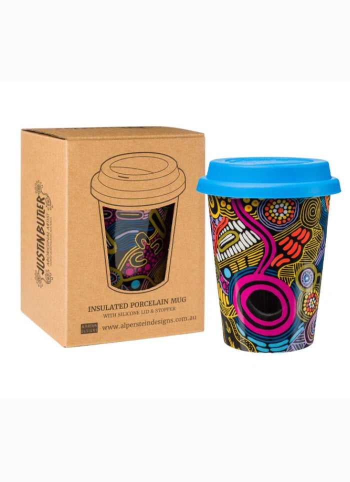 Colorful insulated mug with blue lid next to its packaging on a white background