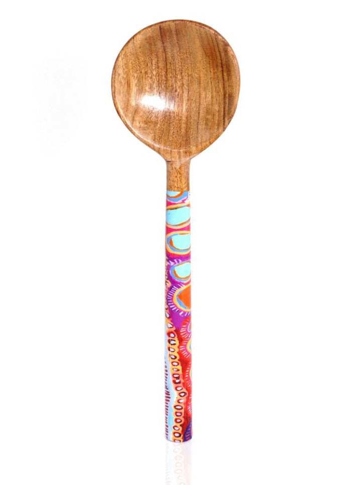 Wooden spoon with a colorful handle on a white background