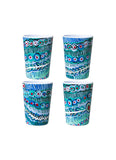 Four colorful cups with patterned design on a white background