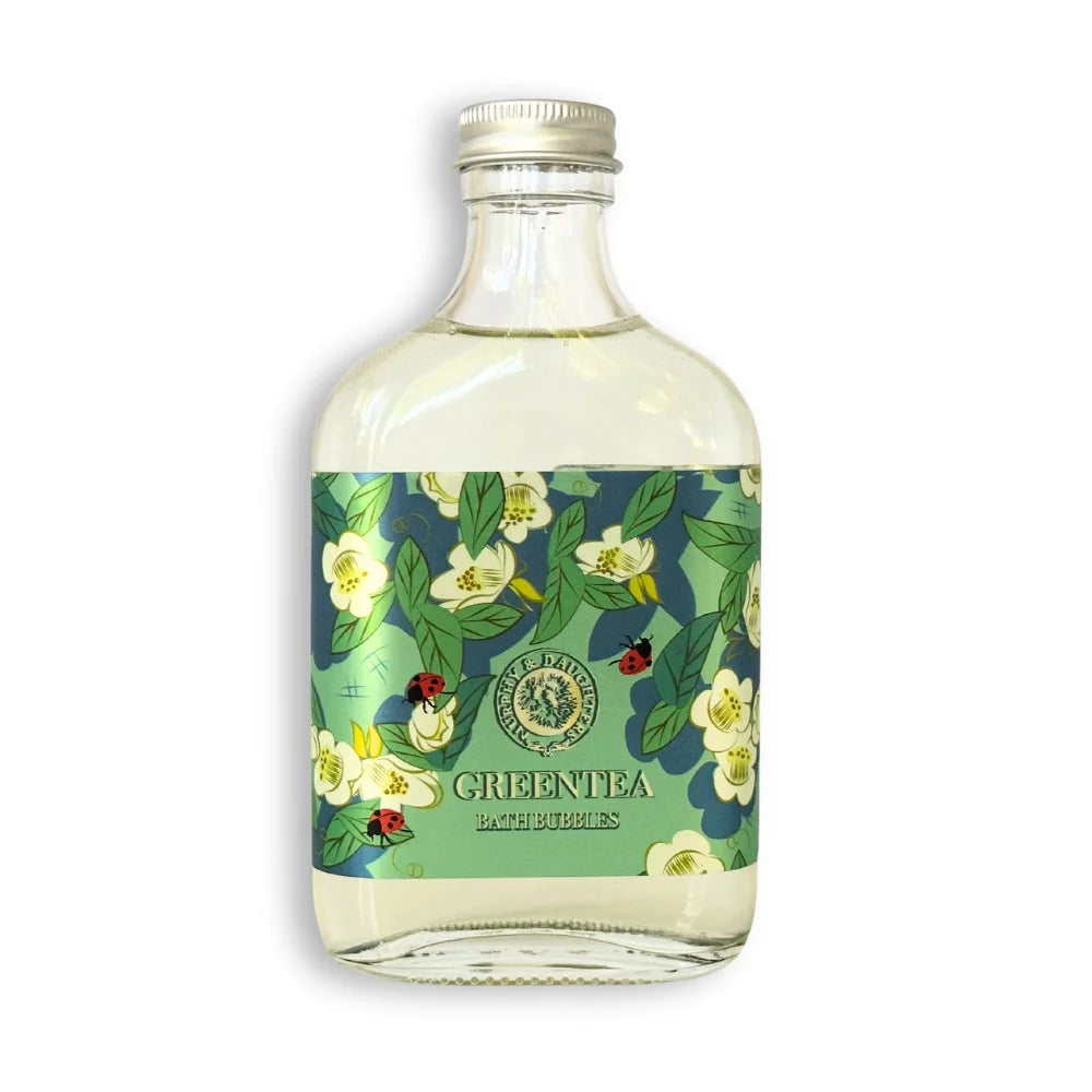 Bottle of green tea with floral label on a white background