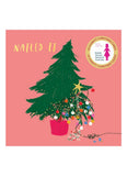 Christmas card with a decorated tree on a pink background, featuring the text 'Nailed It' and a logo.