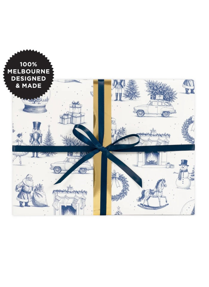 Gift box with blue and white pattern and navy ribbon, featuring '100% Melbourne Designed & Made' label.