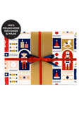 Gift box with festive pattern and red ribbon, labeled '100% Melbourne Designed & Made'.