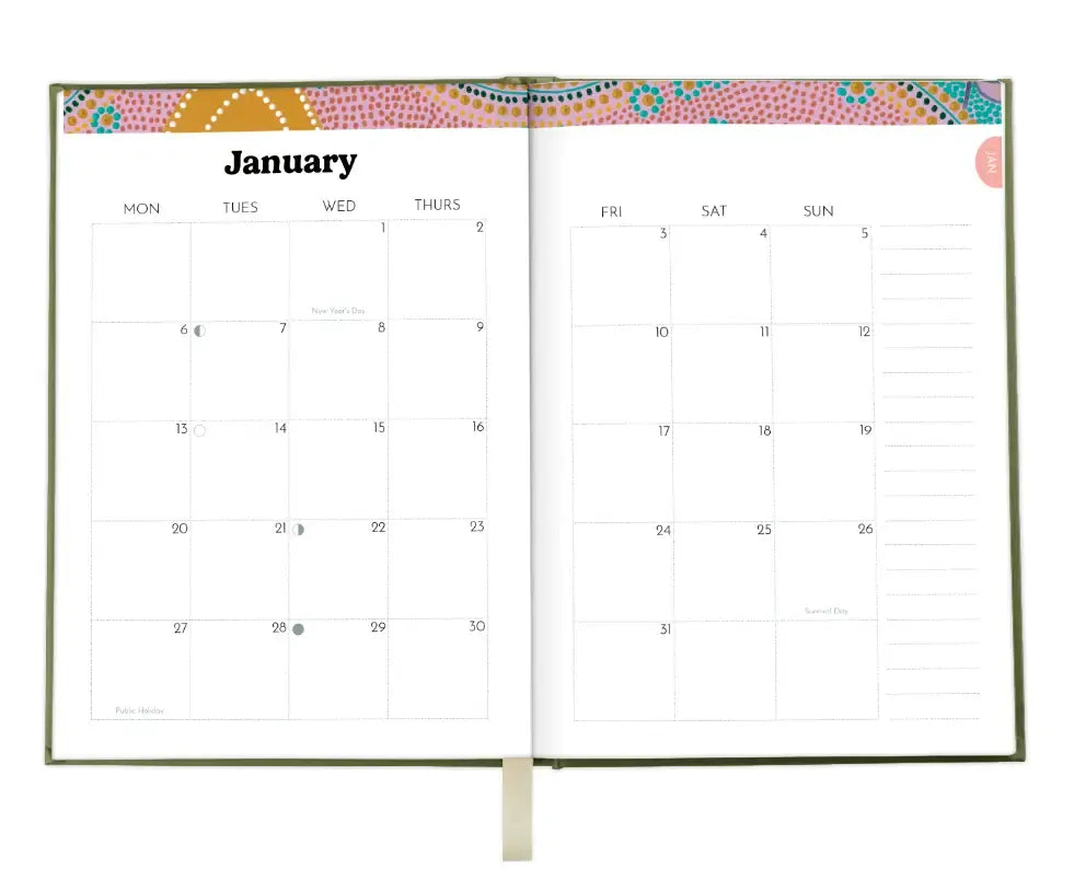 Calendar open to January with decorative top border