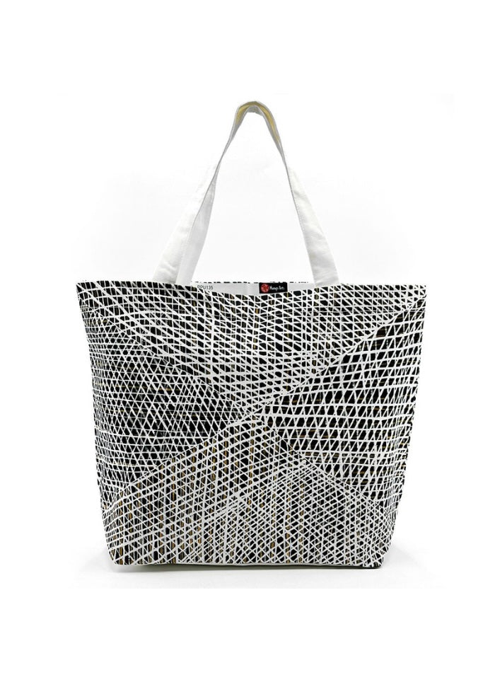 A canvas tote bag produced by Better World Arts and based on artwork by Paulina Puruntatameri.