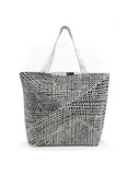 A canvas tote bag produced by Better World Arts and based on artwork by Paulina Puruntatameri.