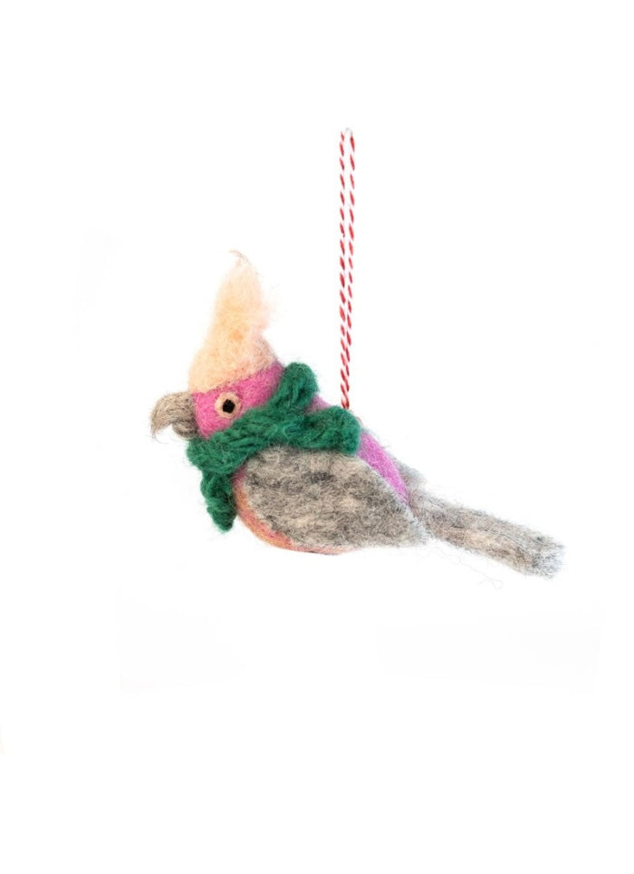 Decorative bird ornament with a colorful scarf on a white background
