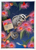Card with a sugar glider and eucalyptus flowers on a blue background