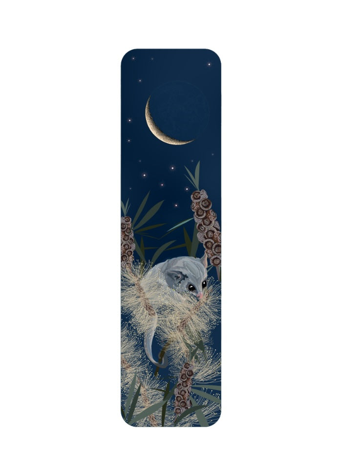 Bookmark with a design of a small animal in a natural setting on a dark blue background.