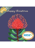 A Christmas-themed card design with a large red and green floral illustration on a dark blue background, plus the words 'Happy Christmas' and an 'Australian Artist' badge. An RSPCA logo appears in a circular badge at the lower right.