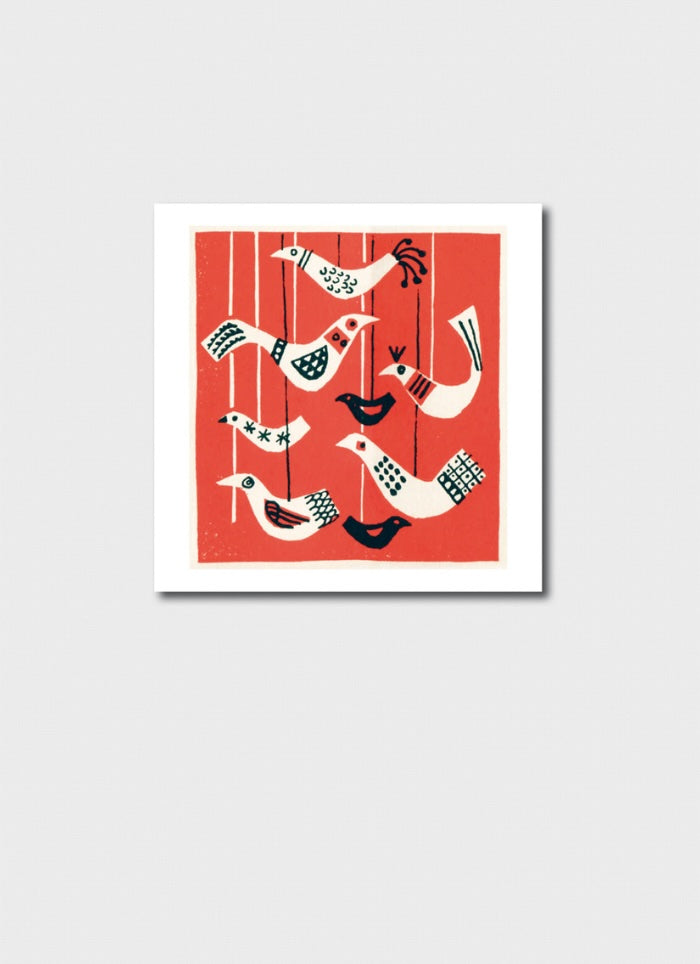 A small square card with a red background and white birds.