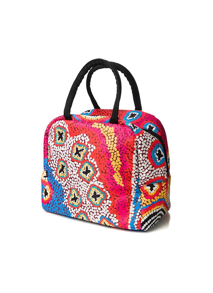 A lunch bag with black handles in colourful abstract design