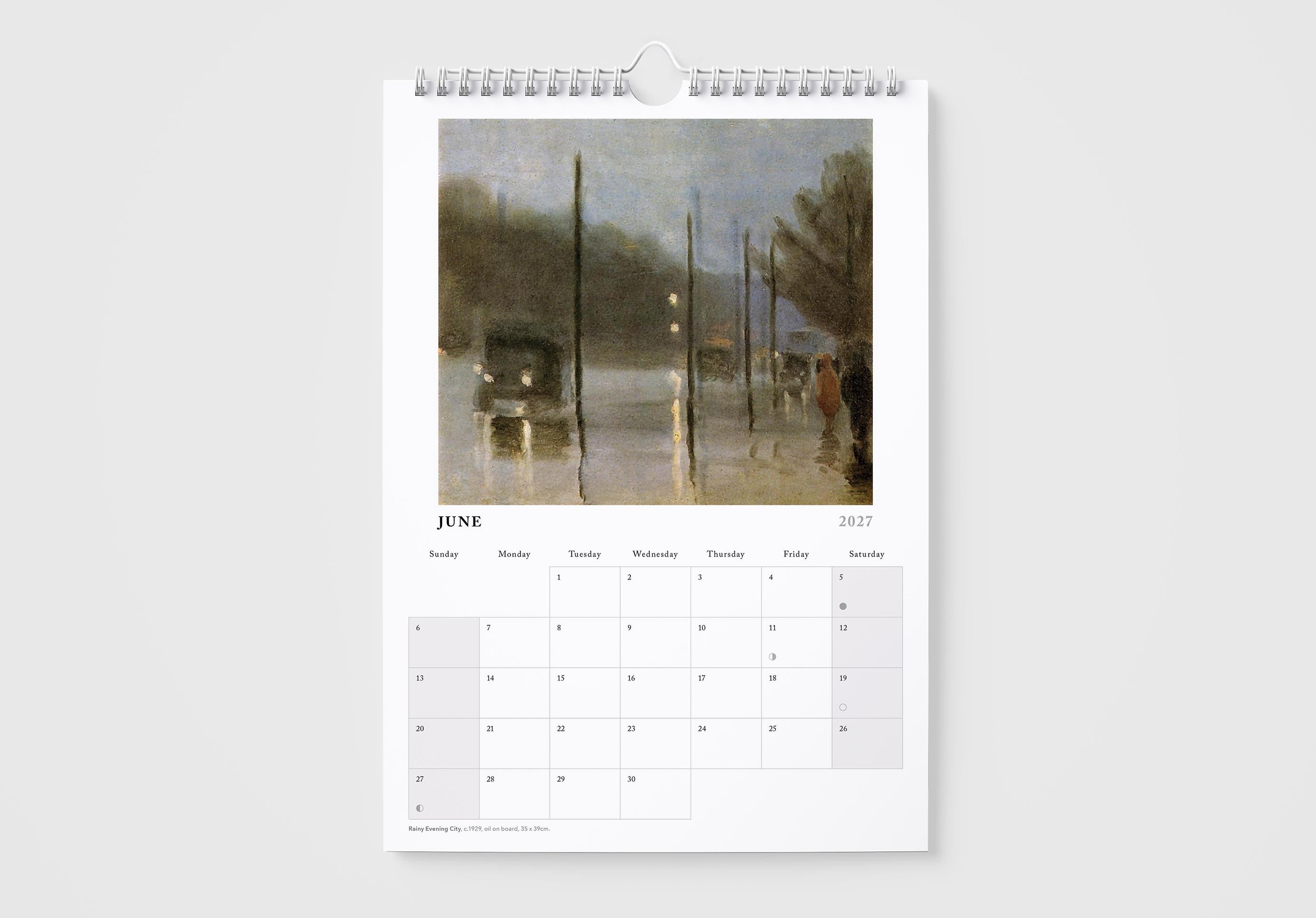 Calendar page for June showing a painting of a rainy street scene.