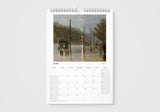 Calendar page for June showing a painting of a rainy street scene.