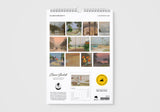 Calendar with artistic landscape images on a white background