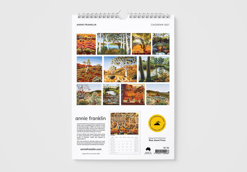 Wall calendar with nature-themed images on a white background