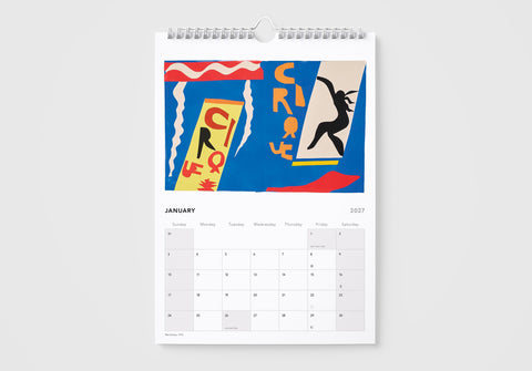Calendar with a colorful circus-themed cover on a white background