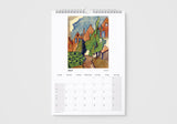 Calendar with a painting of houses and trees on a white background