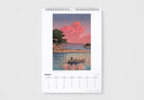 Calendar with a painting of a boat on a lake under a pink sky, on a white background