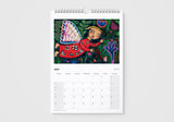 Calendar for July with a colorful illustration of a fairy on a white background
